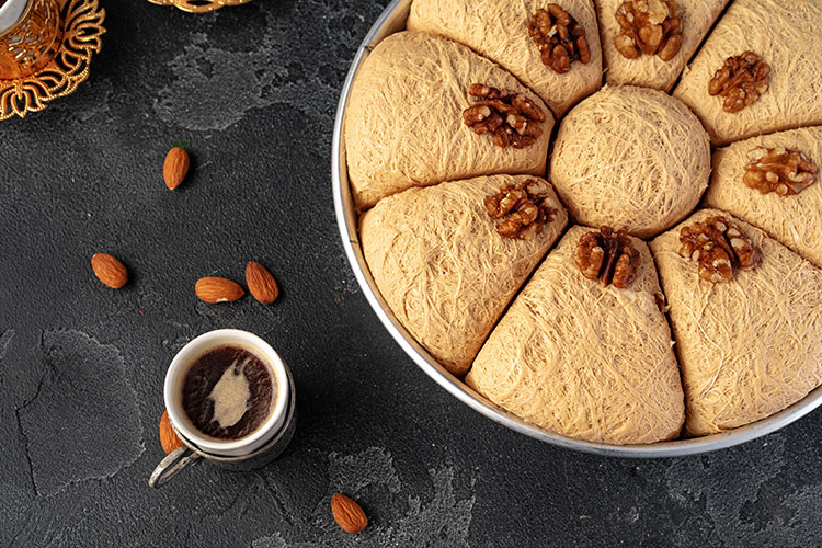 turkish-dessert-baklava-with-nuts-on-black-backgro